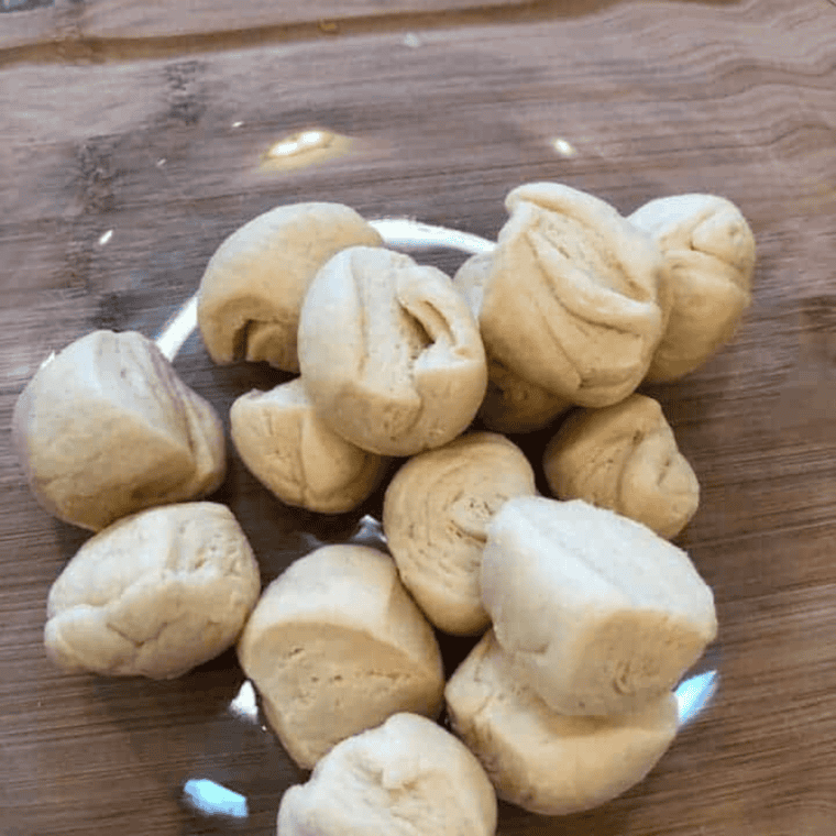 Cut the biscuits in a large mixing bowl.