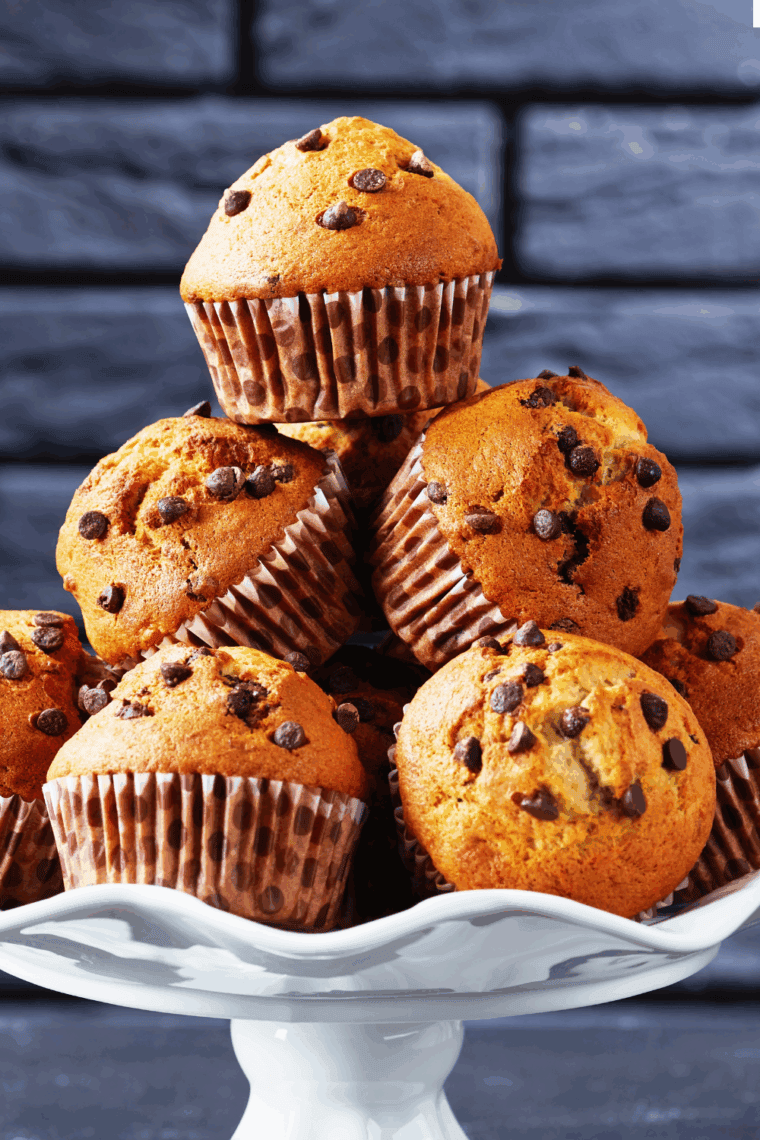 Golden, fluffy banana chocolate chip muffins baked in the air fryer with melted chocolate chips