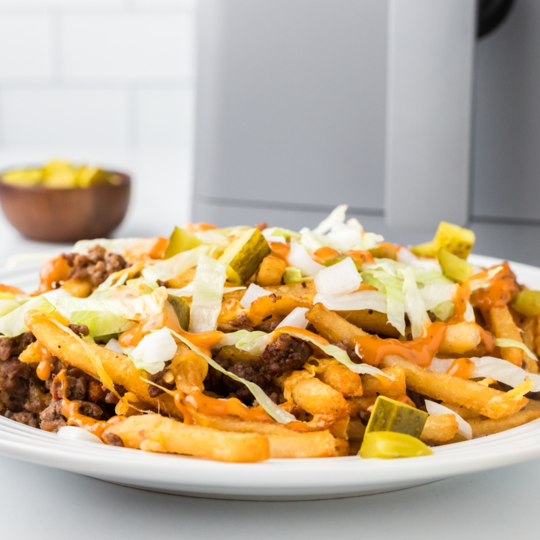 "Deliciously crispy chili cheese fries served in a bowl with toppings."