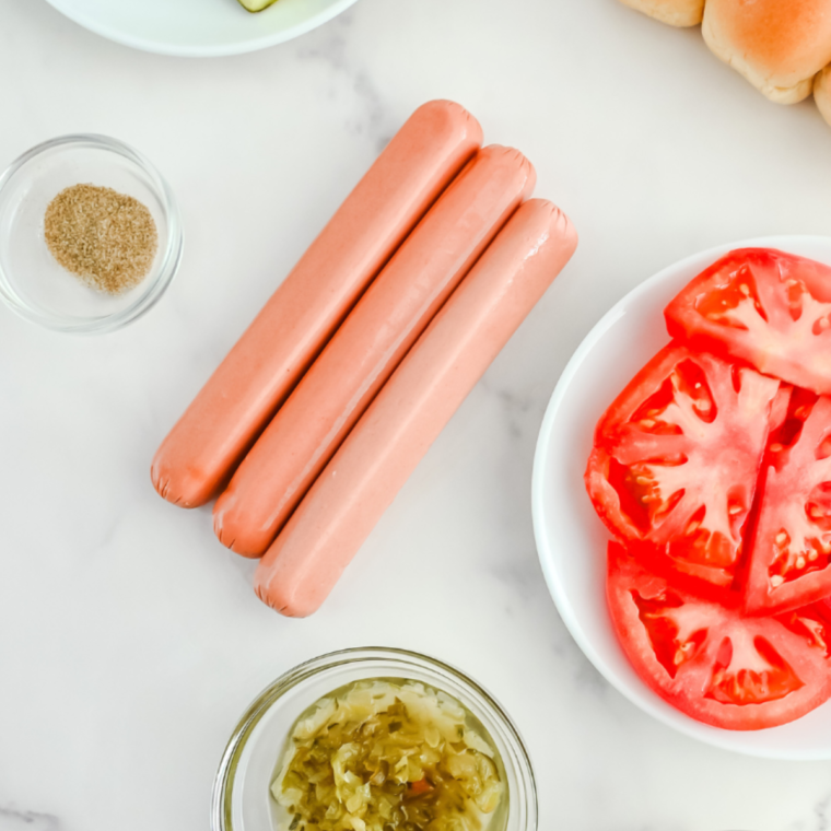 Air Fryer Corn Dog Muffins with Ingredients: Air fryer corn dog muffins displayed alongside ingredients like hot dogs, cornbread mix, and condiments.