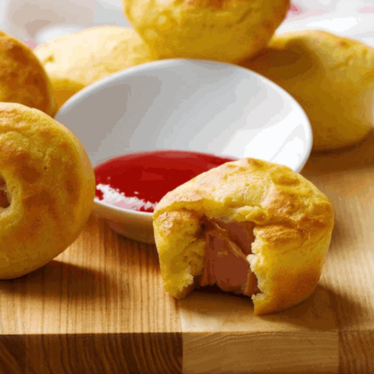 Air Fryer Corn Dog Muffins Freshly Baked: Golden-brown corn dog muffins just out of the air fryer, displaying their fluffy texture.