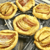 Can I use homemade pastry dough instead of store-bought? Absolutely! Homemade pastry dough can provide a richer flavor and texture. Just ensure it's rolled out to the recommended thickness and is chilled before using. 2. How do I store leftover apple tarts? Store any leftover apple tarts in an airtight container at room temperature for up to 2 days. For longer storage, refrigerate them, and they can last for up to 5 days. 3. Can I freeze air fryer apple tarts for later? Yes, you can freeze them either before or after air frying. If freezing before, place the uncooked tarts on a baking sheet in the freezer until solid, then transfer to a zip-top bag. When ready to eat, cook directly from frozen, adding a few extra minutes to the cooking time. 4. Can I use other fruit fillings in this recipe? Absolutely! Feel free to substitute apples with pears, berries, or even a mix of fruits. The cooking time may vary slightly based on the moisture content of the fruit. 5. My tarts burst open while cooking. What did I do wrong? This can happen if the tarts are overstuffed or if the edges aren't sealed properly. Make sure to leave enough of a border around the edge when adding the filling and press the edges firmly to seal. 6. How do I ensure the bottom of the tarts get crispy? Ensuring there is enough space between each tart in the air fryer basket can help the hot air circulate better, making the bottoms crispy. Additionally, preheating the air fryer can also help. 7. Can I glaze or add toppings to my apple tarts? Definitely! A simple glaze made from powdered sugar and a little milk or lemon juice drizzled over the top can add an extra layer of sweetness. You can also sprinkle them with powdered sugar or cinnamon sugar right after they come out of the air fryer for added flavor.b