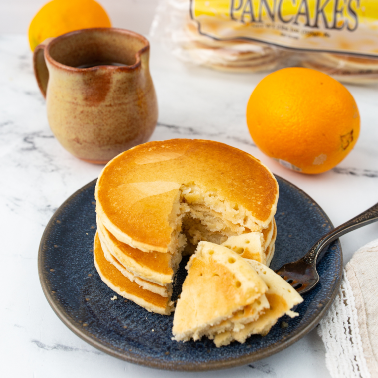 Frozen pancakes crisping in air fryer basket until golden and hot