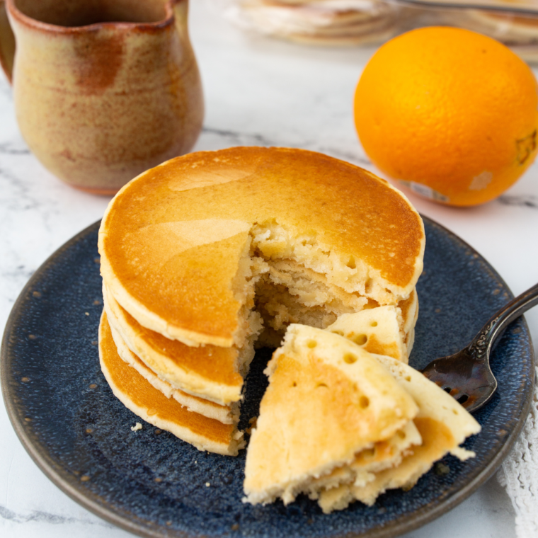 Frozen pancakes crisping in air fryer basket until golden and warm