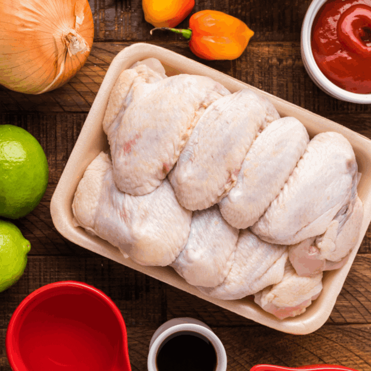 Ingredients needed for Domino’s Hot Buffalo Chicken Wings (Copycat) on kitchen table.