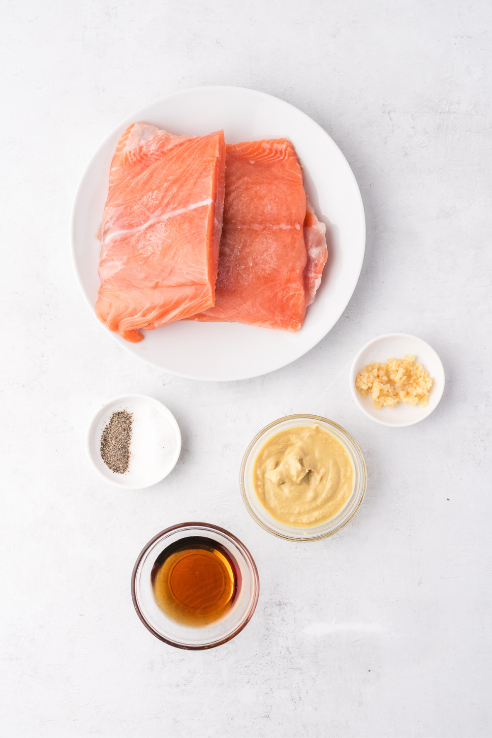 Ingredients needed for Frozen Salmon in the Air Fryer — No Thawing, Flaky & Tender in 16 Minutes on kitchen table.