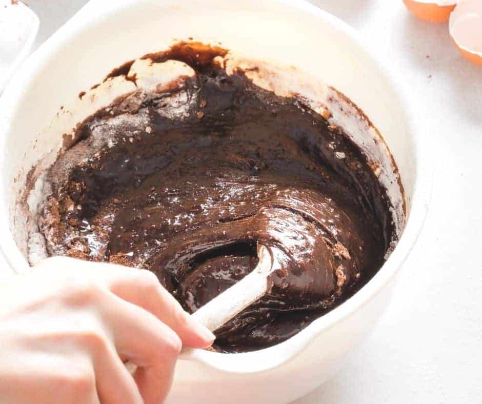 Mixing brownie batter in a bowl for air fryer brownie bites
