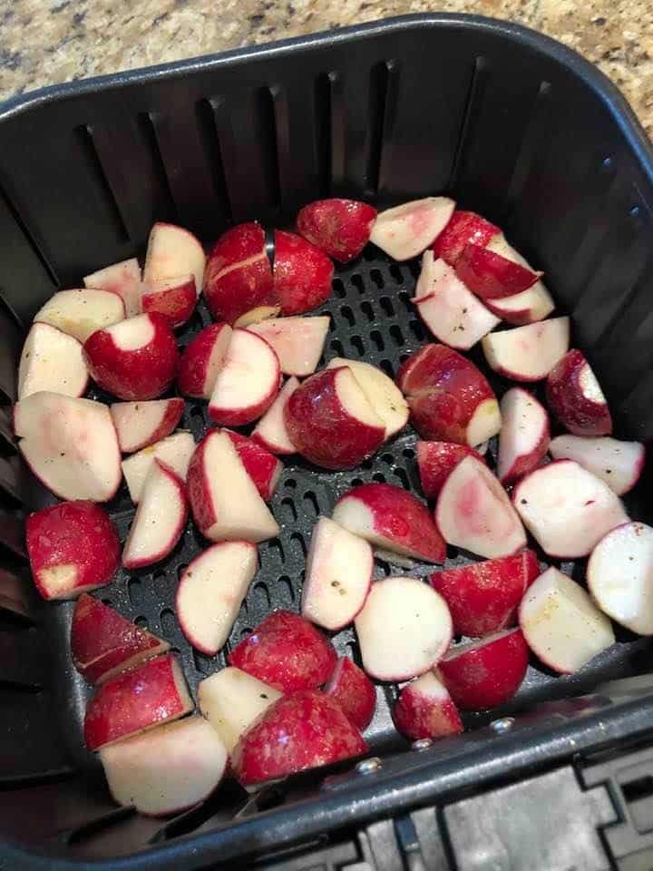 Step 3: SeasonThe Radishes
Add your sliced radishes, olive oil, salt, and pepper to a medium mixing bowl, and toss to coat.