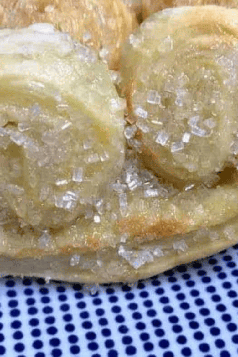Golden, crisp Air Fryer French Palmiers arranged on a plate, showing delicate puff pastry layers.