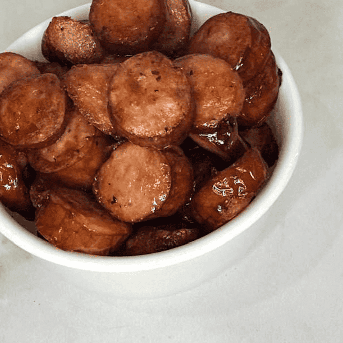Sliced kielbasa cooked in the air fryer until golden and crispy.