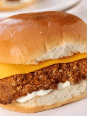 Crispy, golden Culver’s Fish Sandwich served with lettuce and tartar sauce on a bun.