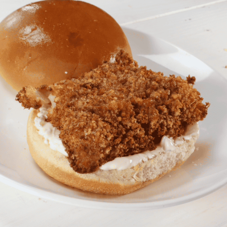 Plate Culver's Cod Fish Sandwich with tartar sauce.
