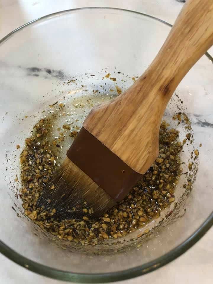 Step 1: Season the chicken
Mix the olive oil, lemon juice, minced garlic, and Italian seasoning in a small bowl. Mix well.
Use a pastry brush and brush over the chicken.
