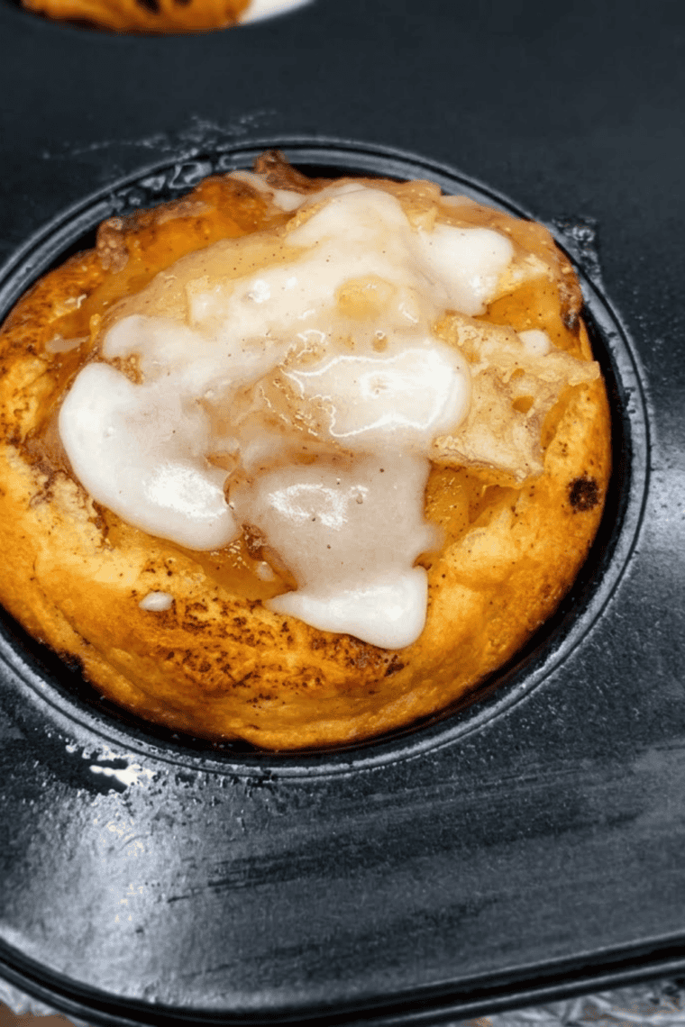Two ingredients for apple pie cups — cinnamon rolls with icing and a bowl of apple pie filling