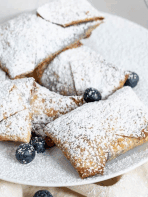 These Easy Air Fryer Blueberry Cheesecake Egg Rolls feature a crispy, golden exterior with a creamy, sweet blueberry cheesecake filling. Perfect for a quick dessert or a fun treat, they’re simple to make and irresistible to eat.