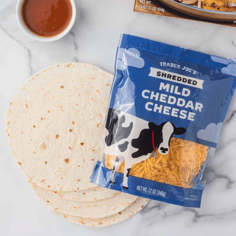 Ingredients needed for Air Fryer Caramelized Onion and Mushroom Quesadilla on kitchen table.