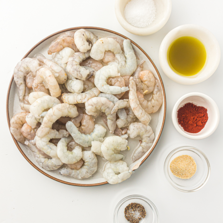 Ingredients needed for Easy Air Fryer Lemon Garlic Shrimp on kitchen table.
