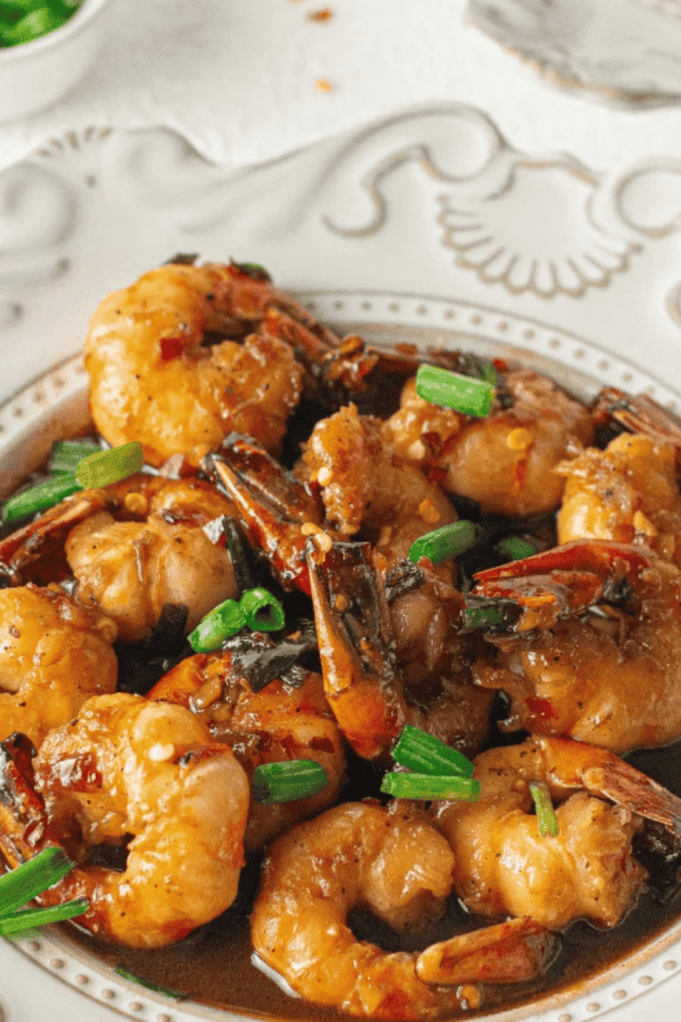 Air fryer honey garlic shrimp coated in sticky honey garlic glaze, topped with green onions