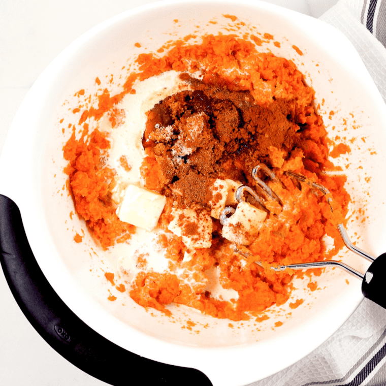 Melted butter, brown sugar, vanilla, and cinnamon mixed into mashed sweet potatoes with diced pecans folded in