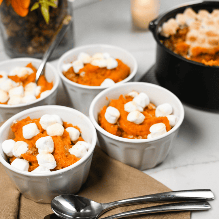 Air fryer sweet potato casserole topped with golden marshmallows and pecans in a baking dish