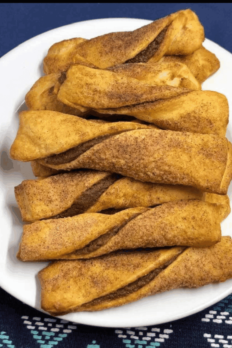 golden-brown apple pie Danish twists filled with cinnamon-spiced apples and drizzled with glaze