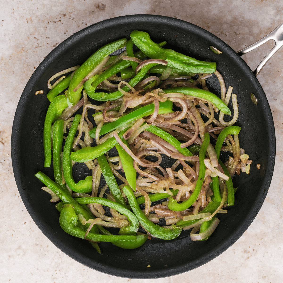 Sautéed red onion and bell pepper in olive oil until softened, then transfer to a small bowl.