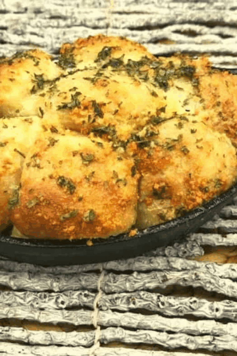Air fryer garlic parmesan monkey bread baked golden in a round pan