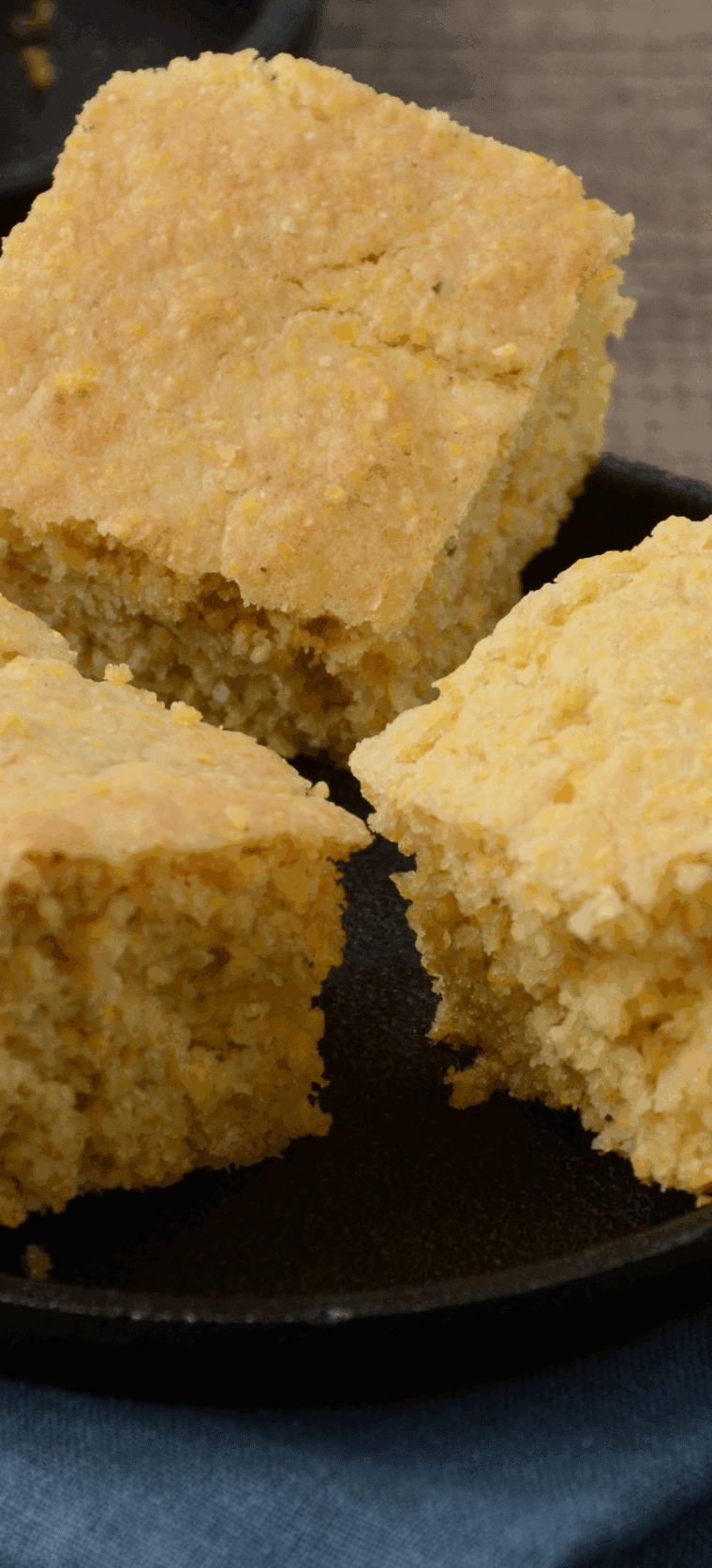 Slices of moist, golden Boston Market-style cornbread served on a white plate.