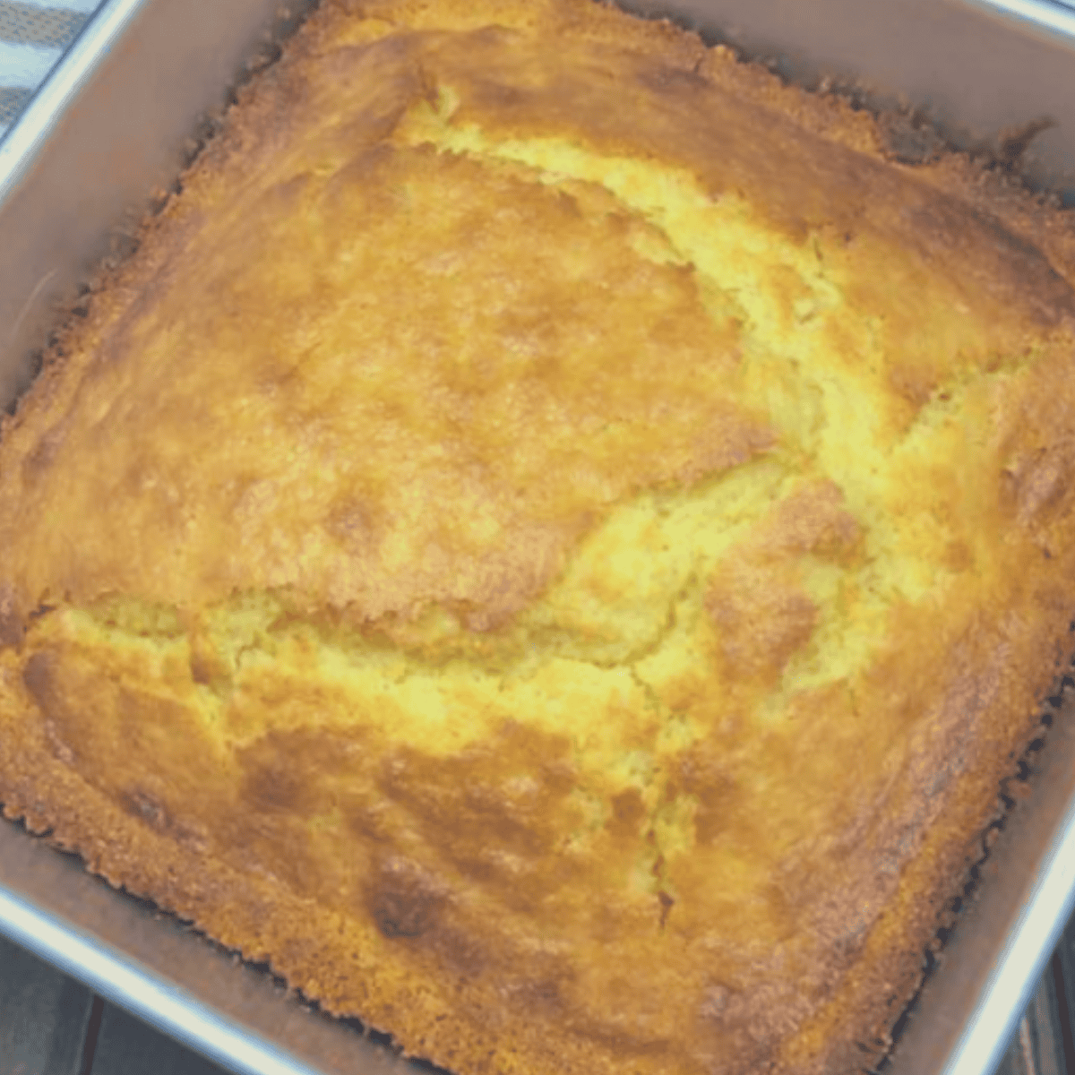 Homemade Boston Market-style cornbread slices on a white plate, golden and fluffy with a soft crumb.
