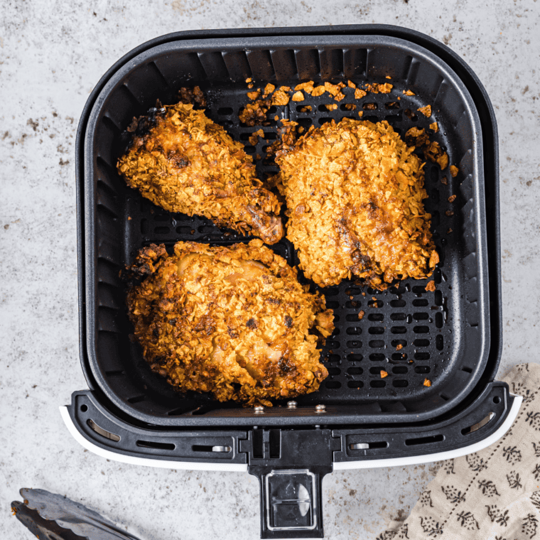 Golden Captain Crunch Chicken tenders served on a plate with fries and Creole mustard sauce