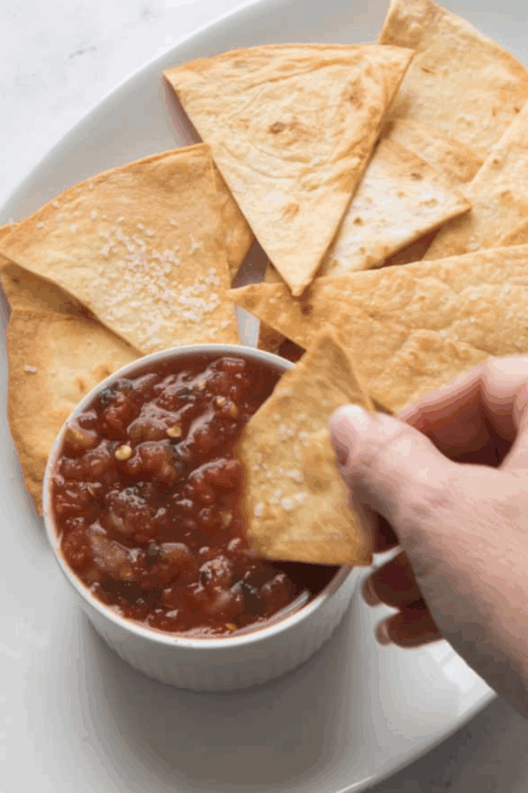 Copycat Chili’s Salsa made with fresh tomatoes, jalapeños, and spices, ready to serve as a delicious dip or topping for tacos.