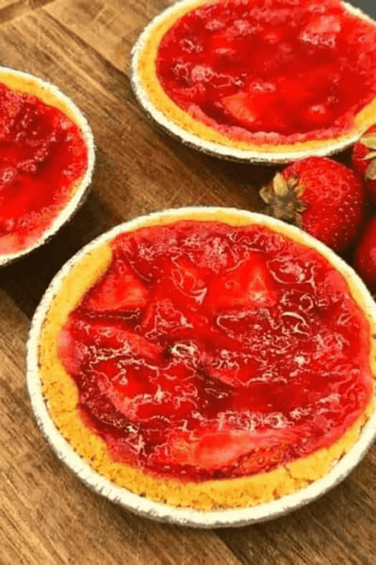 Golden mini strawberry pies made in the air fryer with flaky crust and fresh strawberry filling