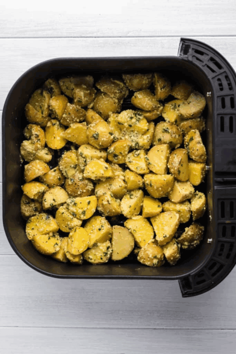 Spreading seasoned potato mixture in a single layer in the air fryer basket
