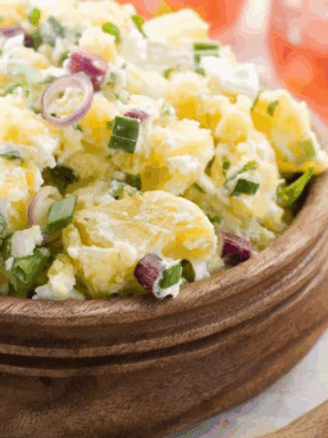 Bowl of creamy Hellmann’s Original Potato Salad with tender potato chunks and classic seasonings.