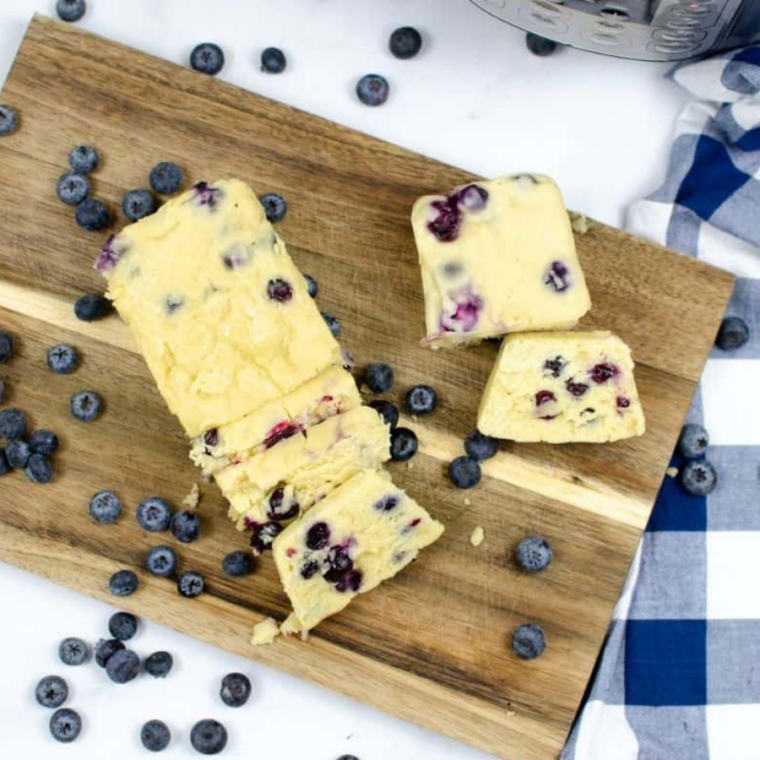 Close-up of blueberry loaf cooked in Instant Pot with golden top and berries