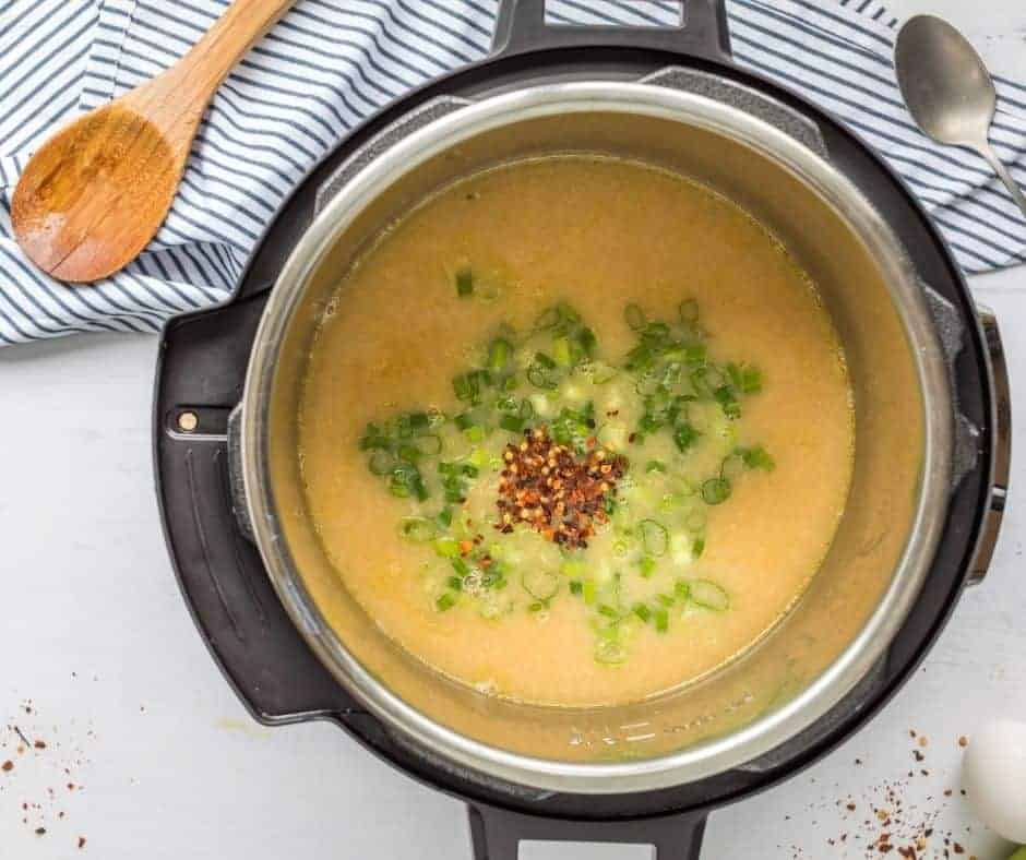 "Cooking broth and seasonings in the Instant Pot for Chinese Imperial Palace Egg Drop Soup."