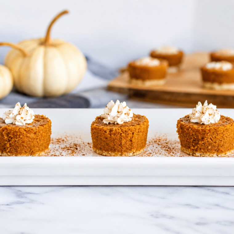 Chilled pumpkin pie on a table with a biscuit cutter and towel beside it