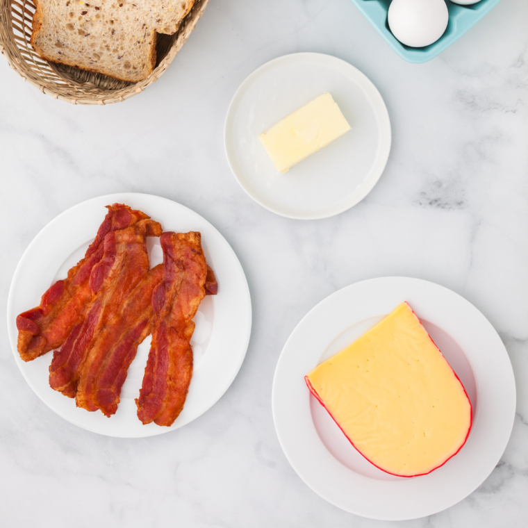 Ingredients needed for Air Fryer Bagel Sandwich on kitchen table.
