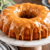 Air fryer cinnamon swirl bundt coffee cake with caramel glaze dripping down the ridges