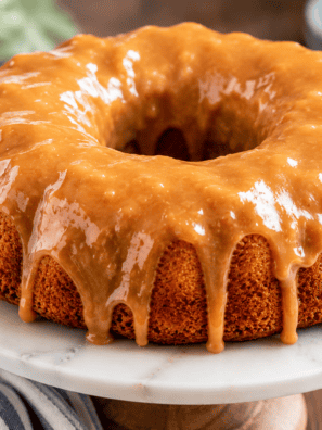 Air fryer cinnamon swirl bundt coffee cake with caramel glaze dripping down the ridges