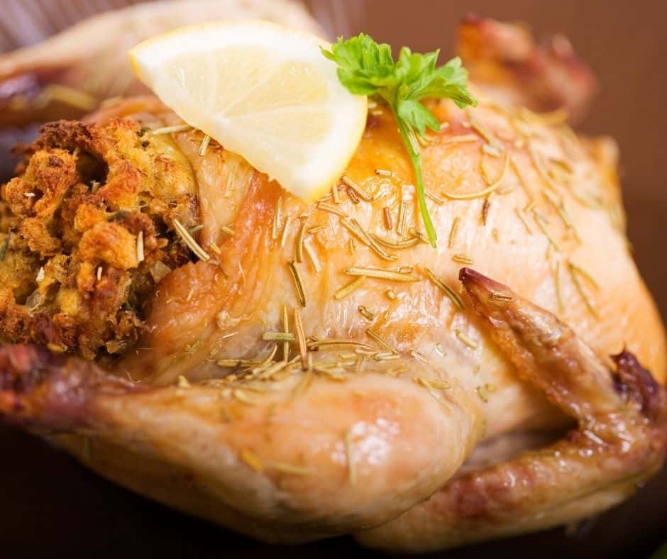 Cornish hen stuffed with lemon on top.