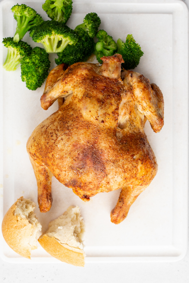 Roasted air fryer Cornish hens resting on a plate before serving