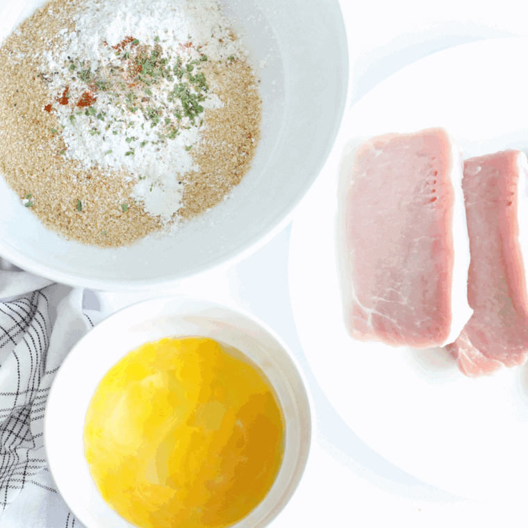 Mixing breadcrumbs and Mexican spices in a shallow bowl for air fryer pork chops.