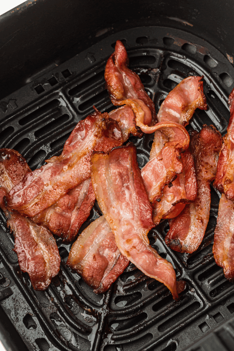 Cooked Oscar Mayer Bacon in air fryer basket.