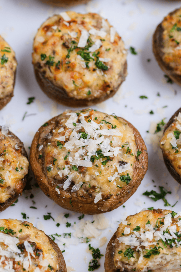 Carrabba’s Italian Grill Stuffed Mushrooms Parmigiana filled with savory stuffing and creamy tomato sauce.