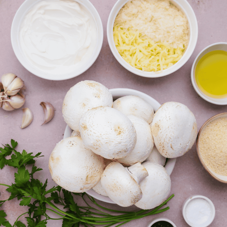 Ingredients needed for Carrabba’s Italian Grill Stuffed Mushrooms Parmigiana Recipe on kitchen table.