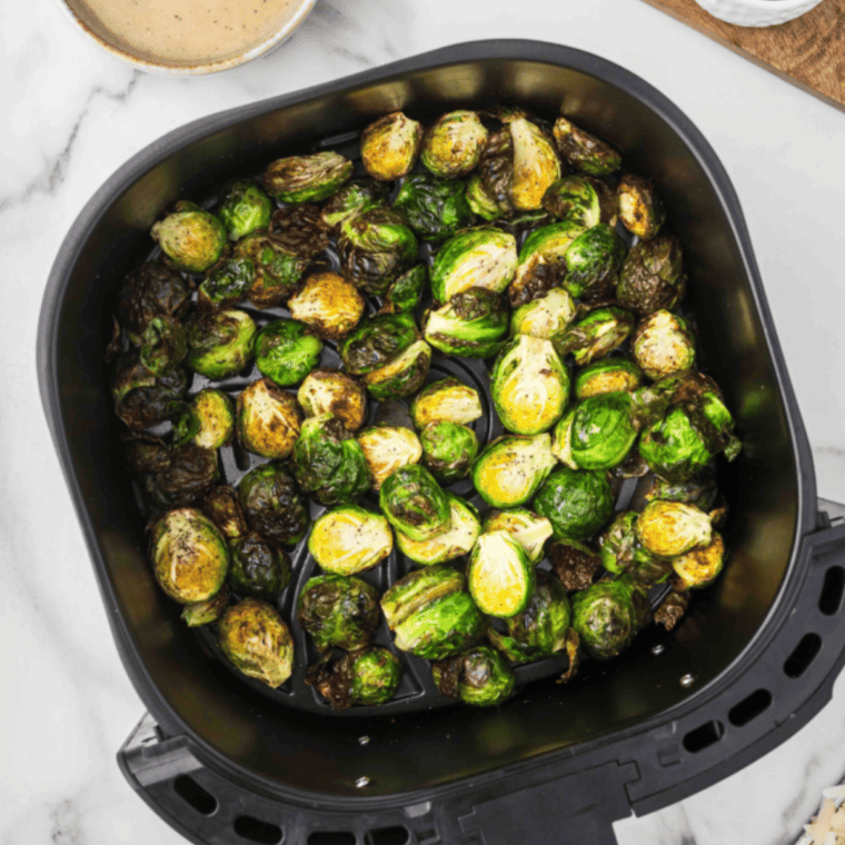 Air fry Brussels sprouts for 15-20 minutes, shaking the basket halfway through, until golden brown, crispy outside, and tender inside.
