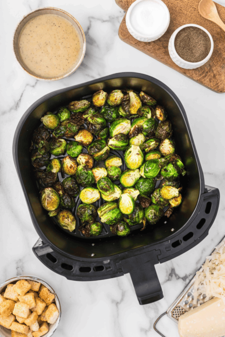 Copycat Ruth Chris Brussels Sprouts cooked in air fryer with crispy edges and golden brown exterior.