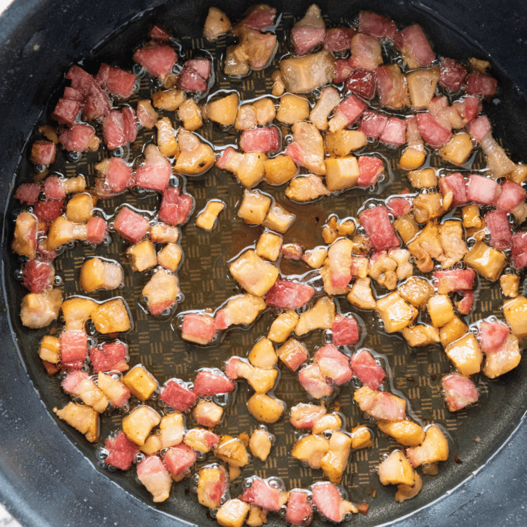 Diced pancetta sautéing in an Instant Pot insert until crispy with rendered fat for carbonara