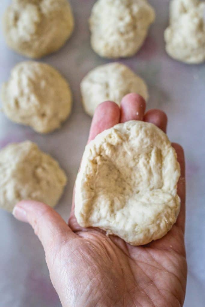 dough divided into 12 portions and shaped into individual rolls by hand